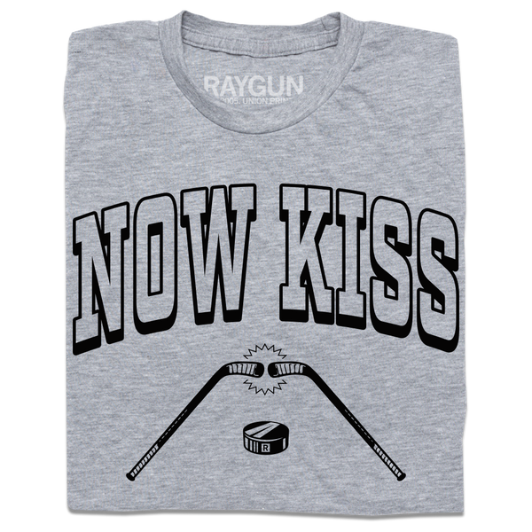 A folded heather grey shirt with blank ink. Curved text reads 