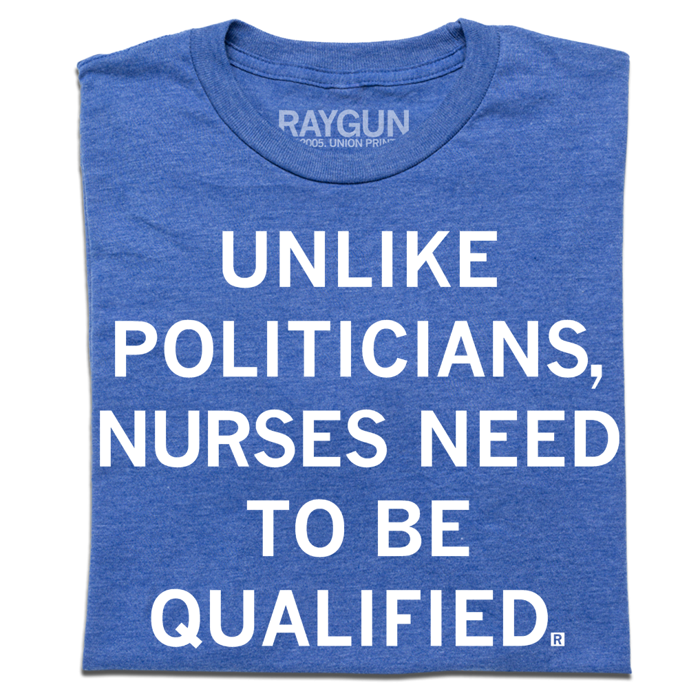 Heather royal blue tee with white ink text that reads, "Unlike politicians, nurses need to be qualified."