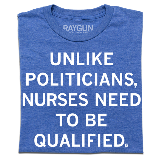 Heather royal blue tee with white ink text that reads, "Unlike politicians, nurses need to be qualified."