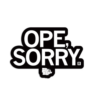 A die-cut vinyl sticker reading OPE, SORRY in white text on a black background, with a small white map of Michigan below the text.