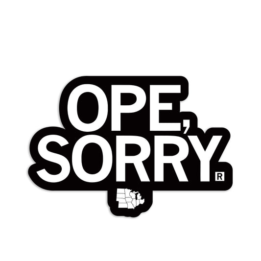 A die-cut vinyl sticker reading OPE, SORRY in white text on a black background, with a small white map of Michigan below the text.