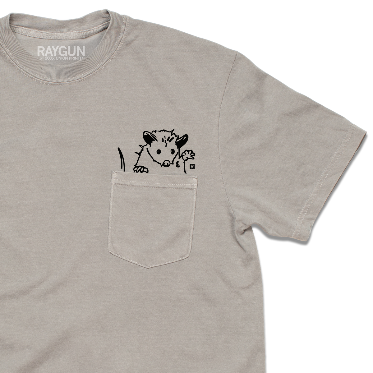 Light gray heavyweight cotton opossum pocket t-shirt with a black illustration of an opossum peeking over the top edge of the chest pocket.