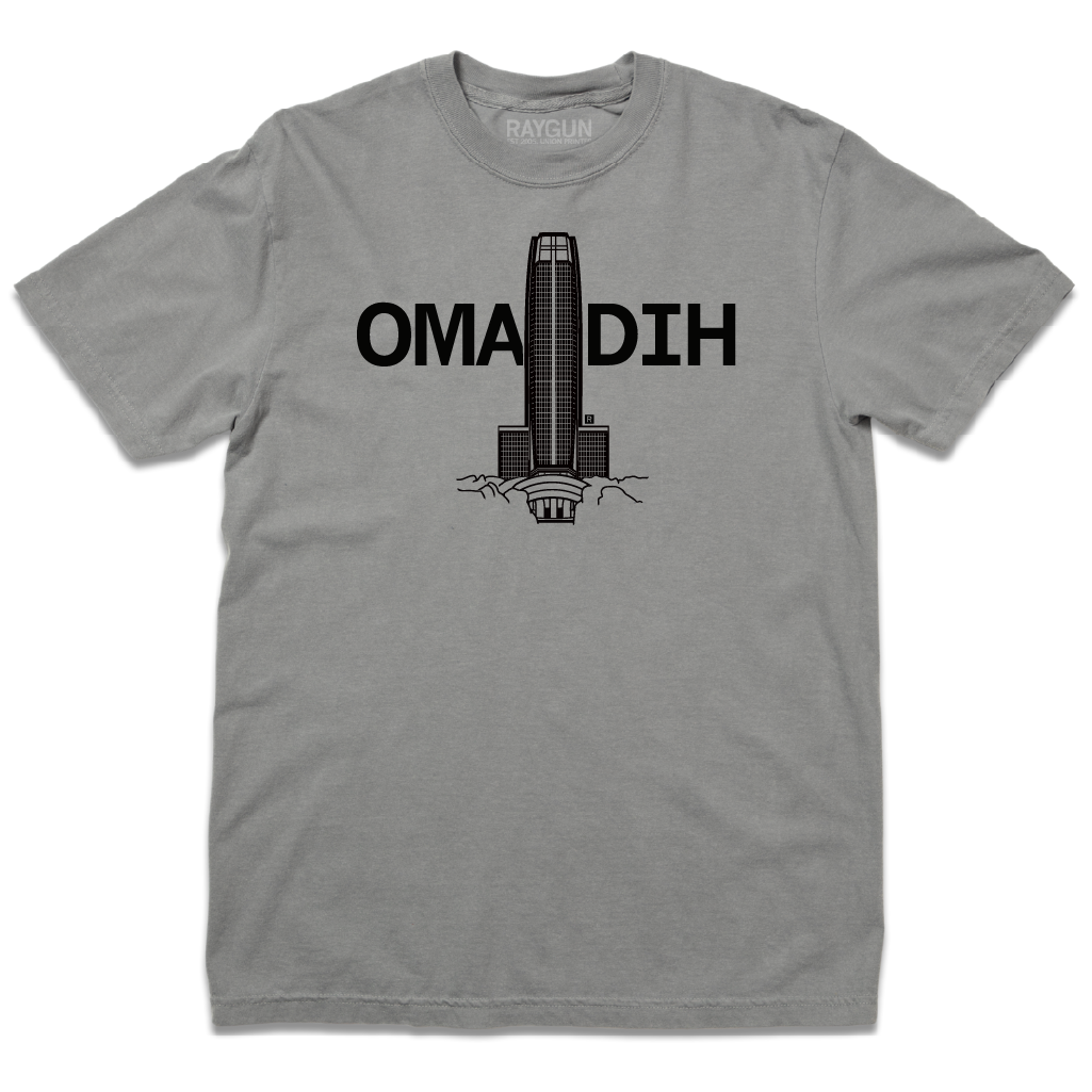 Heavyweight grey t-shirt featuring a black graphic of a skyscraper silhouette separating the letters OMA and DIH.