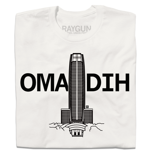 Bone-colored t-shirt with a graphic of a skyscraper behind the text OMADIH.