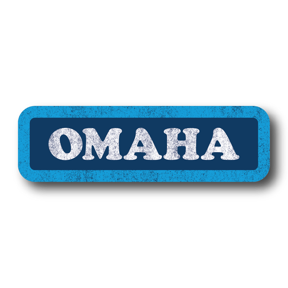 A rectangular dark blue sticker with a light blue border and white text that says, "OMAHA." The whole sticker is in a vintage style, faded look.