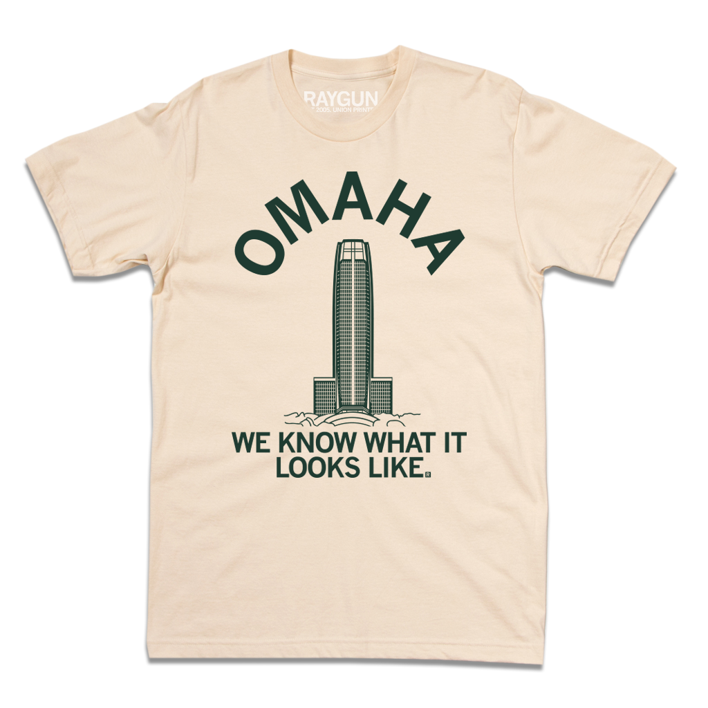 Cream t-shirt featuring a graphic of the WoodmenLife building with the text OMAHA arched above and WE KNOW WHAT IT LOOKS LIKE. below.