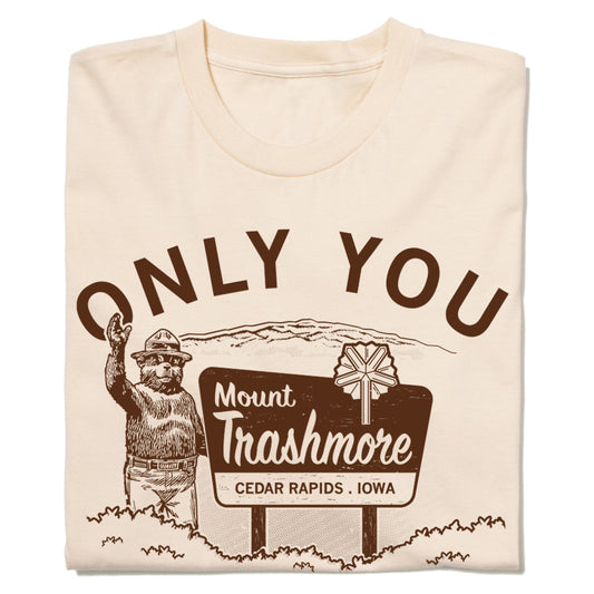 Cream-colored t-shirt featuring a bear in a hat waving next to a sign that reads Only You, Mount Trashmore, and Cedar Rapids, Iowa.