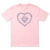 A light pink, combed ringspun cotton RAYGUN t-shirt featuring a purple floral heart design enclosing the text, Love is such a silly thing to hate.