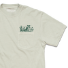 Light gray garment-dyed t-shirt with a chest pocket featuring a dark green botanical print of leaves, flowers, and a butterfly.