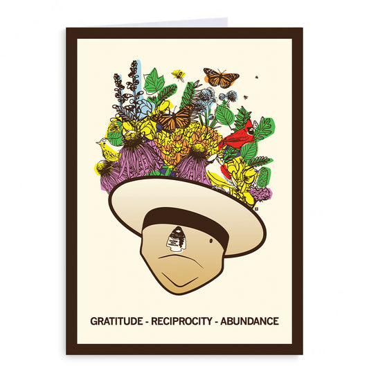 A greeting card illustration of a face wearing a wide-brimmed hat overflowing with flowers, butterflies, and birds, with the text GRATITUDE - RECIPROCITY - ABUNDANCE at the bottom.