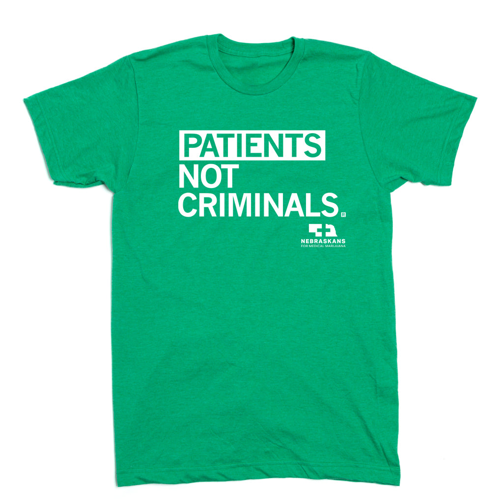 Heather kelly green, union-made t-shirt with white text reading PATIENTS NOT CRIMINALS and the logo for Nebraskans for Medical Marijuana.