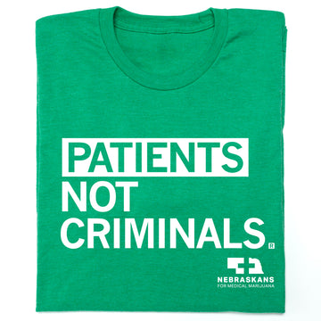 Heather kelly green, union-made T-shirt featuring the text PATIENTS NOT CRIMINALS and the Nebraskans for Medical Marijuana logo.