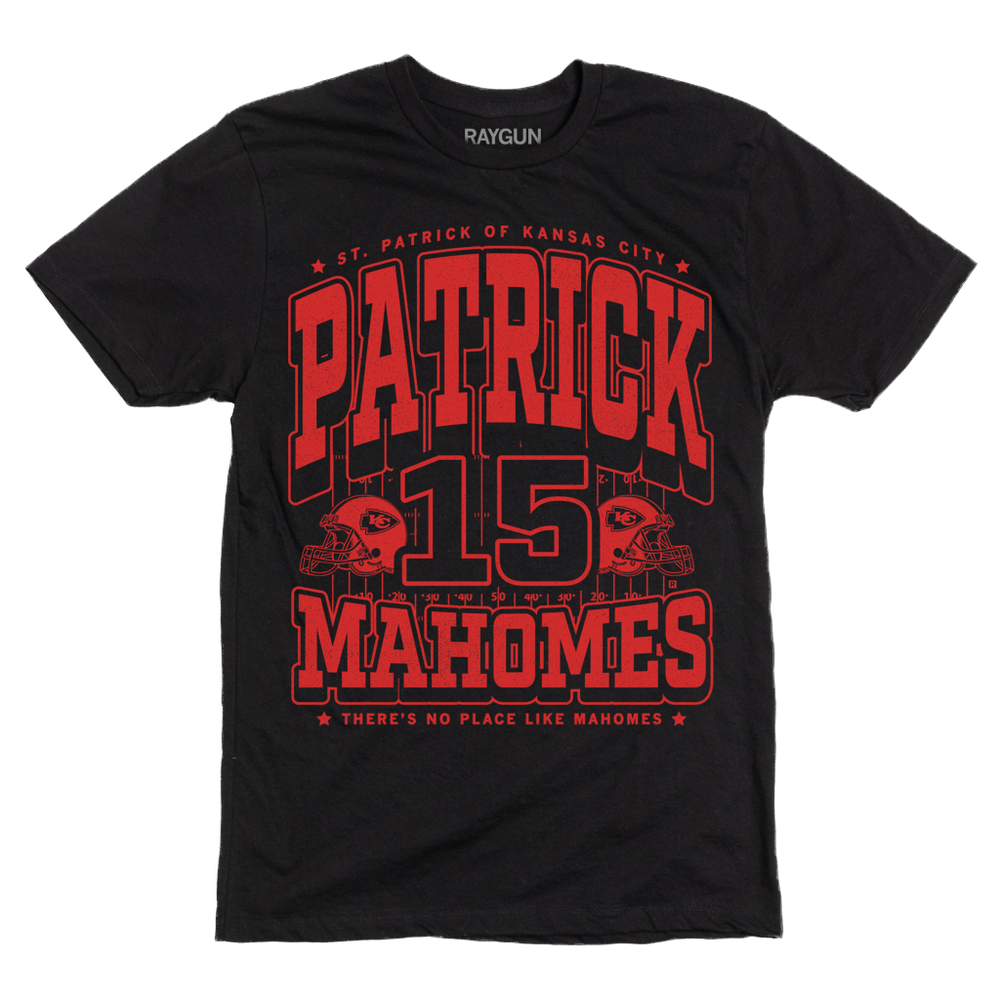 Black shirt with bright red ink that reads "Saint Patrick of Kansas City. Patrick Mahomes #15. There's No Place Like Mahomes" over an illustration of a football field with a football helmet to either side.