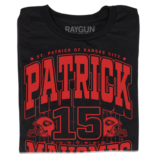 A folded black shirt with bright red ink that reads 