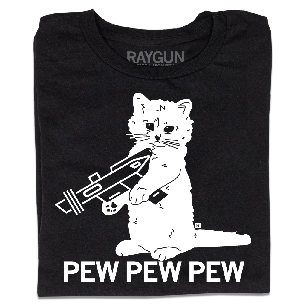 A folded black t-shirt with a white ink illustration of RAYGUN's cat mascot "Gary" holding a RAYGUN. Text below says "PEW PEW PEW"