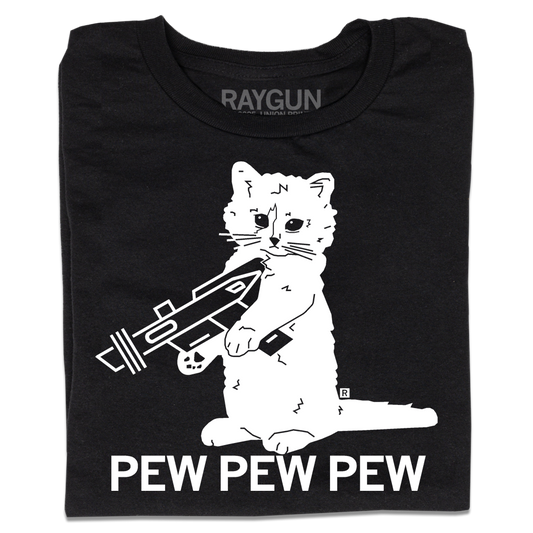 A folded black t-shirt with a white ink illustration of RAYGUN's cat mascot "Gary" holding a RAYGUN. Text below says "PEW PEW PEW"