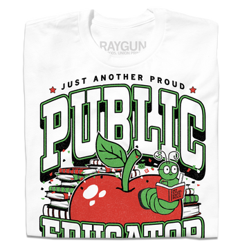 White t-shirt with text in black, green, and white that reads "Just another proud public educator. Teach, change lives, repeat" around a red apply with a bookworm popping out and a stack of red & green books in the back.