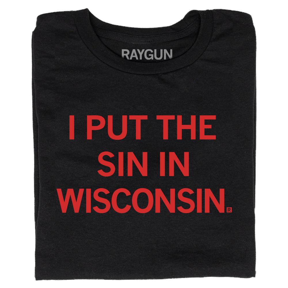 A folded black t-shirt with bright red text that reads "I Put The Sin In Wisconsin"
