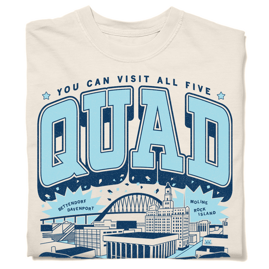 Cream-colored, heavyweight Quad Cities t-shirt featuring the text You can visit all five above a stylized skyline with labels for Bettendorf, Davenport, Moline, and Rock Island.