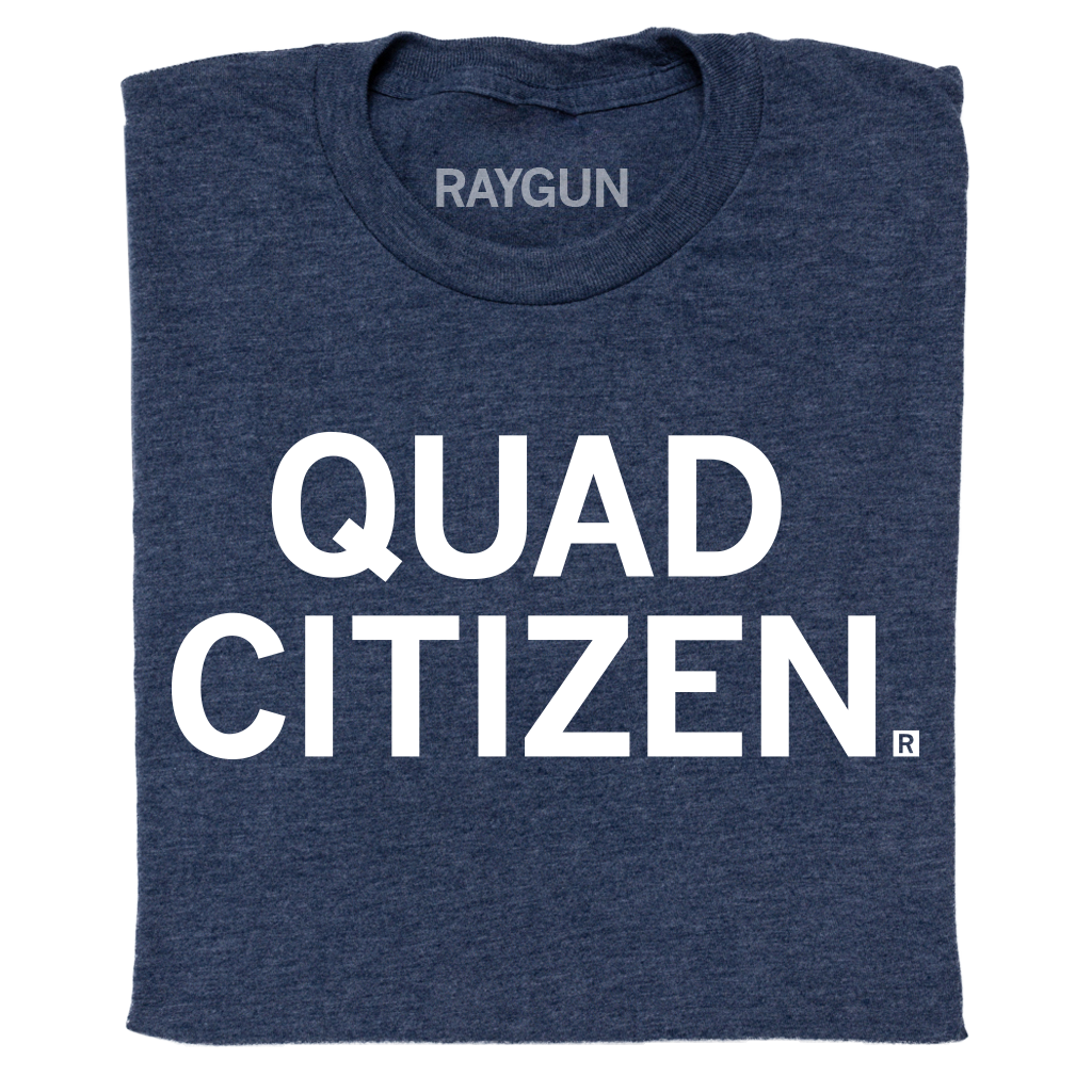 A folded heather navy t-shirt with centered white ink text that reads "Quad Citizen"