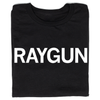 Folded black t-shirt with "RAYGUN" printed in all caps white ink.