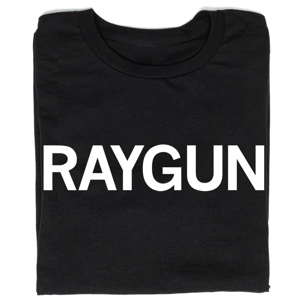 Folded black t-shirt with "RAYGUN" printed in all caps white ink.