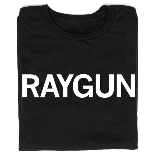 Folded black t-shirt with "RAYGUN" printed in all caps white ink.