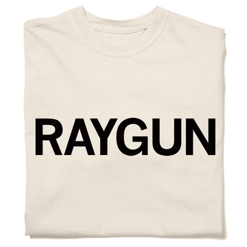 A folded cream heavyweight t-shirt with "RAYGUN" printed in black ink.