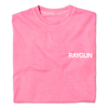 A folded bright pink t-shirt with "RAYGUN" printed over the left side of the chest.