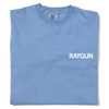 A folded faded blue t-shirt with "RAYGUN" printed in white ink across the left side of the chest.