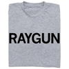 A folded heather grey t-shirt with "RAYGUN" printed in black ink.