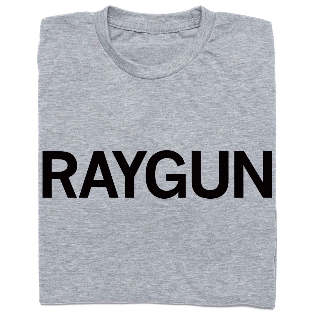 A folded heather grey t-shirt with "RAYGUN" printed in black ink.