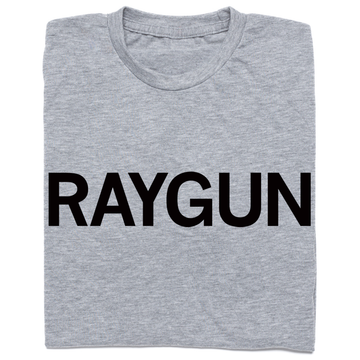 A folded heather grey t-shirt with "RAYGUN" printed in black ink.