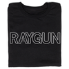 A folded black t-shirt with white outlined text that says, "RAYGUN" across the chest.