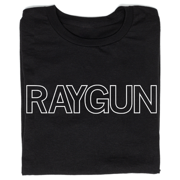 A folded black t-shirt with white outlined text that says, "RAYGUN" across the chest.