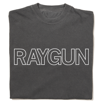 A folded heavyweight grey t-shirt with white outlined text that says, "RAYGUN" across the chest.