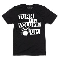 Black shirt with white ink that says "Turn the volume up" to quote Zohran Mamdani's election speech along with an illustration of a volume dial.