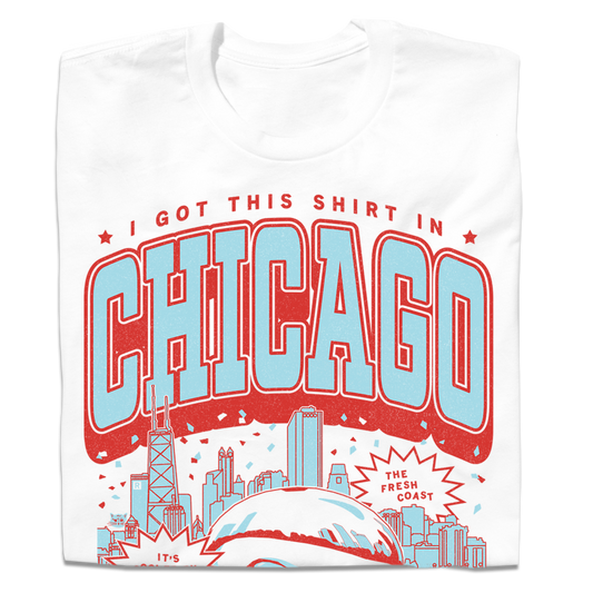 A white Chicago shirt featuring a graphic that says I GOT THIS SHIRT IN CHICAGO above a stylized city skyline and THE FRESH COAST in a speech bubble.