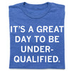 Blue heather royal T-shirt featuring the text ITS A GREAT DAY TO BE UNDER-QUALIFIED printed in white.