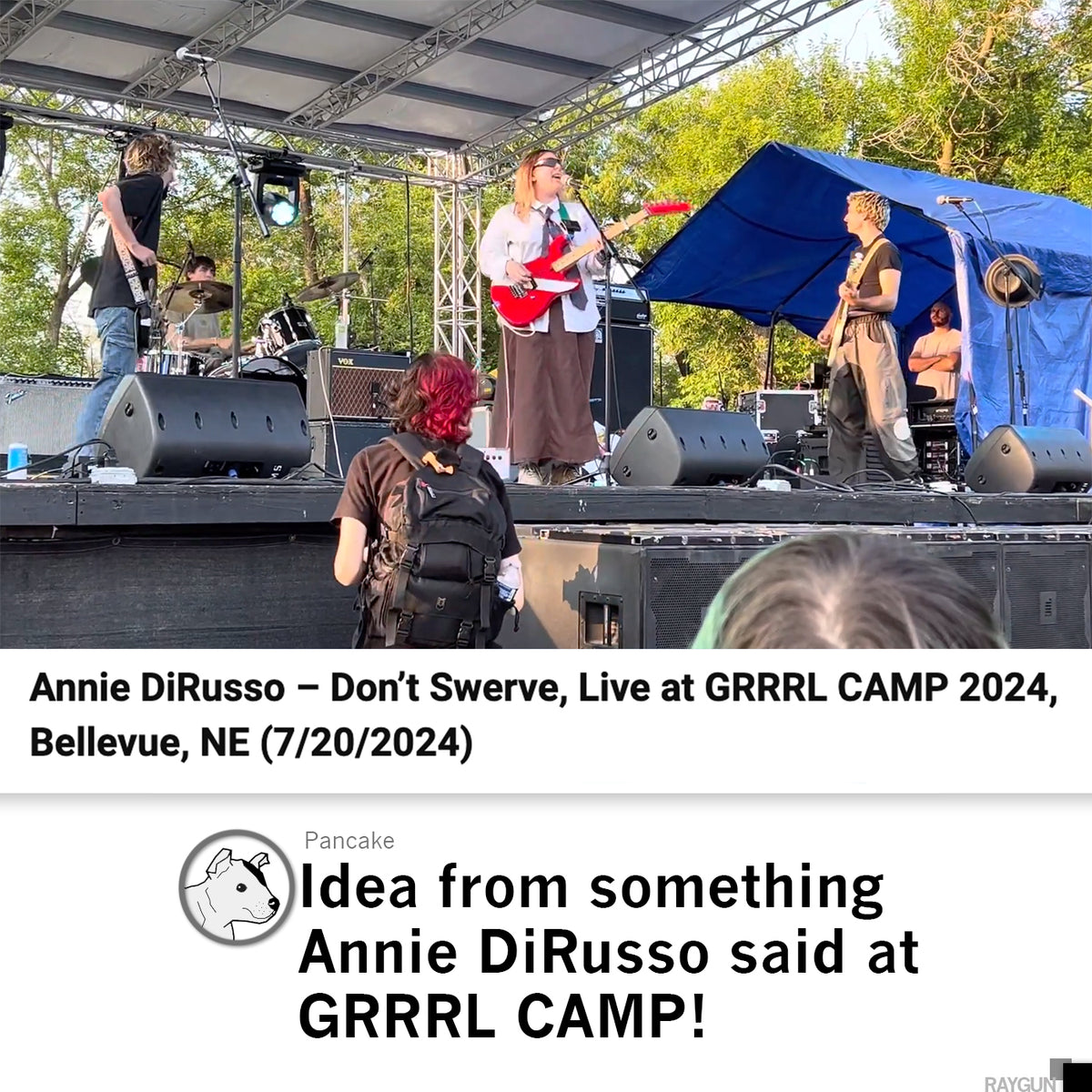 Annie DiRusso performs on an outdoor stage at GRRRL CAMP 2024, singing and playing a red electric guitar while wearing a lime green RAYGUN t-shirt.