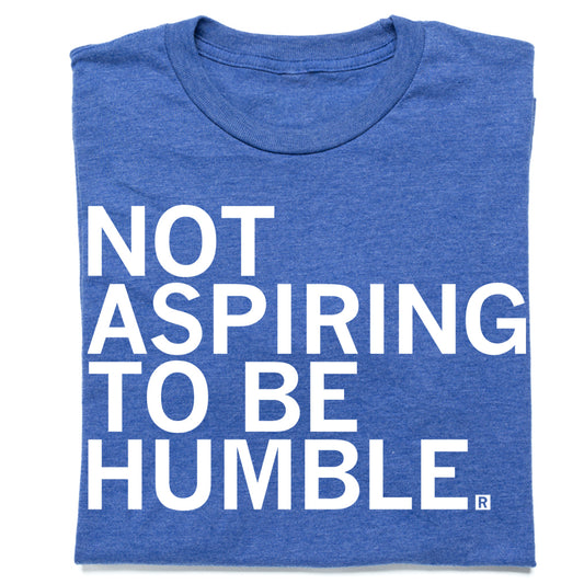 Blue RAYGUN T-shirt with the white text, NOT ASPIRING TO BE HUMBLE.