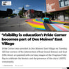 The intersection of East Grand Avenue and East Fifth Street in Des Moines, featuring street corners painted with the Progress Pride flag design in a display of union labor.