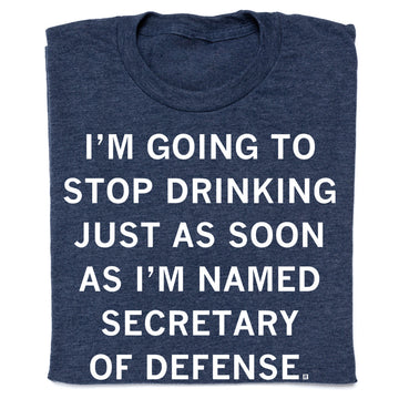 Dark blue heathered RAYGUN t-shirt with the text, I’m going to stop drinking just as soon as I’m named Secretary of Defense.