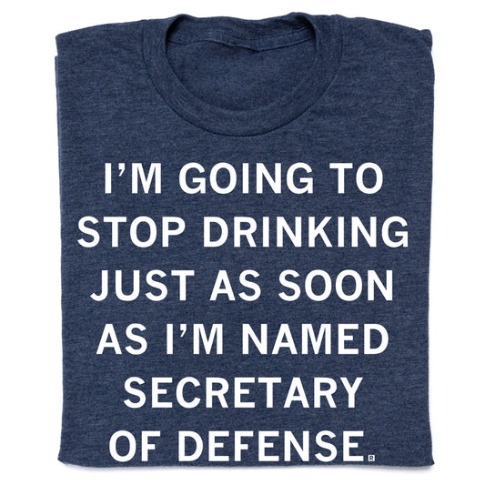 Dark blue heathered RAYGUN t-shirt with the text, I’m going to stop drinking just as soon as I’m named Secretary of Defense.