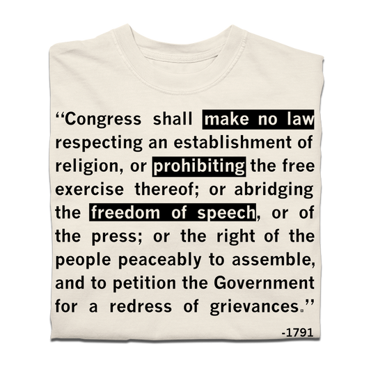 Off-white heavyweight cotton t-shirt printed with the text of the First Amendment, with make no law, prohibiting the free exercise thereof, and freedom of speech highlighted in black boxes, ending with -1791.