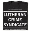 Folded black t-shirt with white text that reads "JUST ANOTHER MEMBER OF THE LUTHERAN CRIME SYNDICATE. A DIABOLIC GROUP STRENGTHENING COMMUNITIES"