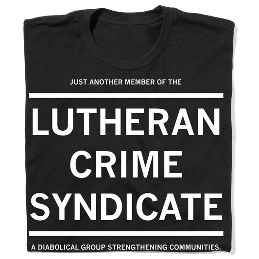 Folded black t-shirt with white text that reads "JUST ANOTHER MEMBER OF THE LUTHERAN CRIME SYNDICATE. A DIABOLIC GROUP STRENGTHENING COMMUNITIES"