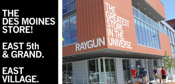 The Raygun store in the East Village of Des Moines, featuring the words The greatest store in the universe on its brick exterior.