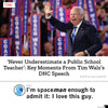 Tim Walz waves to the crowd while speaking at the Democratic National Convention, wearing a heather red t-shirt.