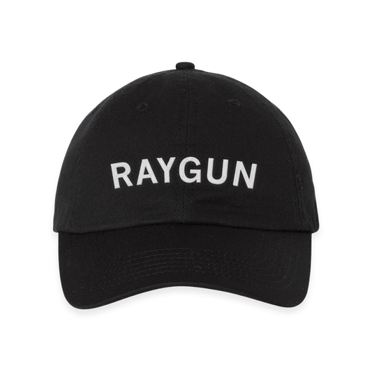 Black embroidered baseball cap with the word RAYGUN stitched in white on the front.